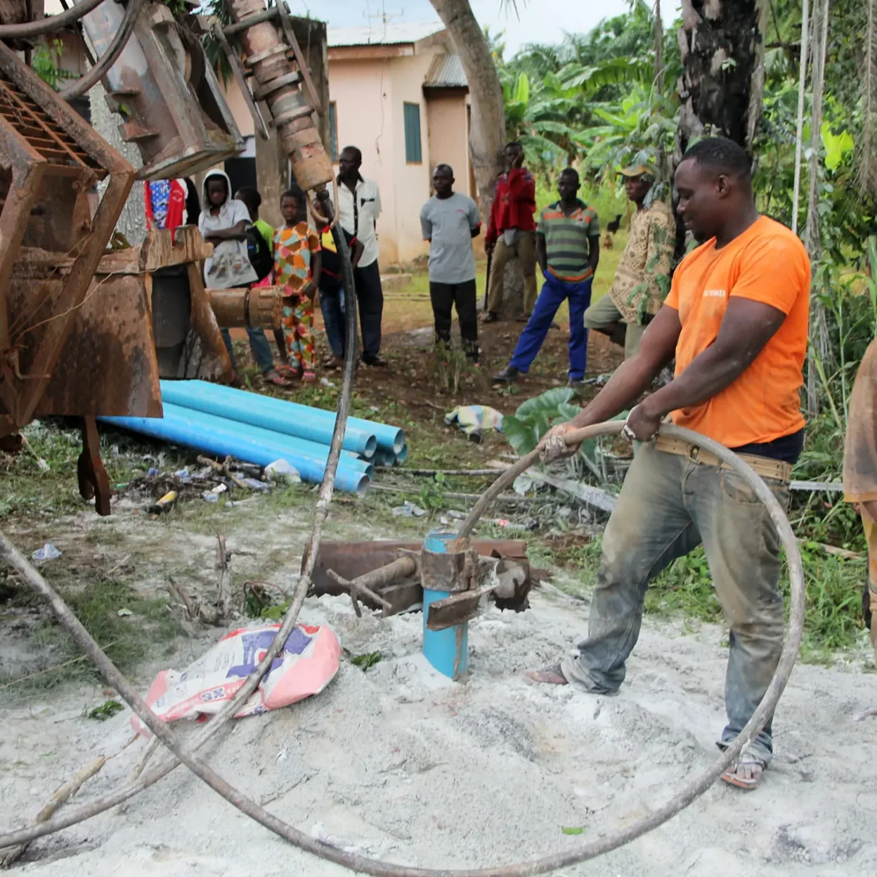 A team drilling a mechanized borehole to provide safe water access for rural communities in Ghana. Community borehole drilling in Ghana supported by GrowthAid to improve WASH services and reduce NTD prevalence.